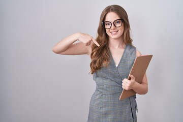 Sticker - Caucasian woman wearing glasses and business clothes looking confident with smile on face, pointing oneself with fingers proud and happy.