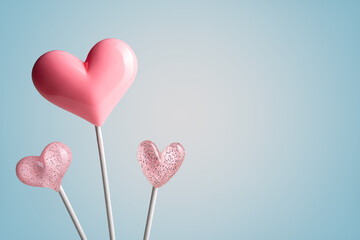 Wall Mural - three Pink Valentine's day heart shape lollipop candy on empty pastel paper background. Love Concept