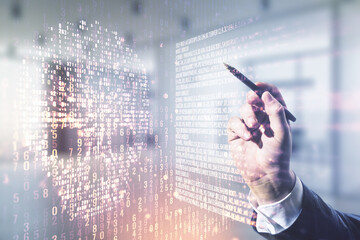 Poster - Male hand with pen working with abstract virtual creative code skull hologram on blurred office background, theft of personal data and malware concept. Multiexposure