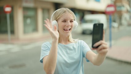 Sticker - Young blonde woman smiling confident having video call at street