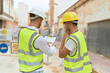 © Krakenimages.com - Two hispanic men architects reading document working at street