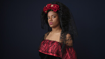 Canvas Print - African american woman wearing katrina costume standing with relaxed expression over isolated black background