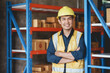 © amnaj - Asian male foreman who inspects warehouse, stock check, inventory count, crossed arms smiling and looking at camera.