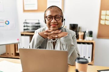 Poster - Senior african american woman call center agent working at office