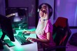 © Krakenimages.com - Young blonde woman streamer smiling confident using computer at gaming room