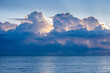 © Tetra Images - Clouds above calm ocean at sunrise