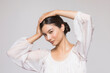 © Tetra Images - Studio portrait of beautiful woman
