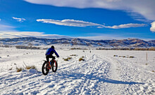 In Winter, Mountain Bikers Rely On Fat Tires For Stability On Snow-packed Trails