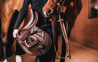 horse rider with brown leather saddle