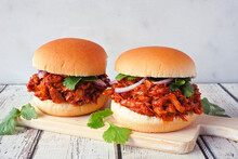 Jack Fruit Meatless Burgers Against A Bright Background. Healthy Eating, Plant-based Pulled Pork Meat Substitute Concept.