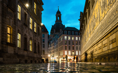 Wall Mural - Dresden, Germany. Evening view from the street Augustusstrabe to the Dresden Frauenkirche and old porcelain artwork Procession of princes (Fuerstenzug), Dresden, Germany.