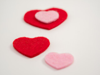 Wall Mural - Hearts and a white flower on a white background. Valentine's Day.