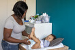 © Anna Berkut/Stocksy - nappy change, mother parent  changing diaper of baby at home