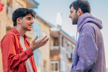 young friends on the street talking