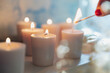 © jamie grill atlas/Stocksy - Lighting Many Candles