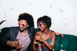 © Lucas Ottone/Stocksy - Glamorous couple celebrating a party