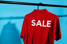Red T-shirt With The Word Sale In A Hanger