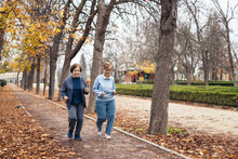 Senior Women Jogging In The Park In The Morning