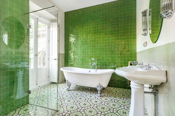 Sticker - Nice bathroom decorated in vintage style with claw bathtub, hydraulic tiles on the floor and green walls