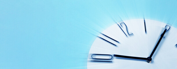 Fleeting time concept. Clock on light blue background, motion effect. Banner design with space for text