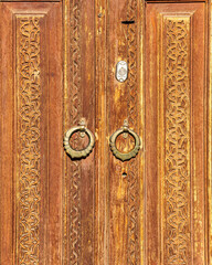 Wall Mural - Carved wooden doors with patterns and mosaics.