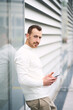 © Maria Vitkovska - Young handsome man holding smartphone using mobile app shopping online