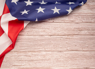 Part of the American flag is on a wooden table