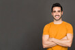 © luisrojasstock - Happy man smiling at the camera while crossing the arms