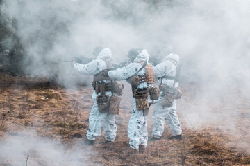 Wall Mural - Special Operations Forces, soldiers in winter camouflage with machine guns move through the trench, war, Ukraine