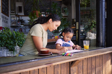 Wall Mural - Coffee shop, black family and crayons with a mother and daughter coloring a book at a cafe window together. Art, creative and love with a woman and happy female child bonding in a restaurant