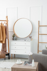 Sticker - Interior of stylish dressing room with mirror, clothes and drawers