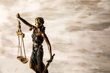 Wall Mural - Justice statue on wooden background