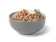 Bowl of tasty buckwheat porridge with butter and dill on white background