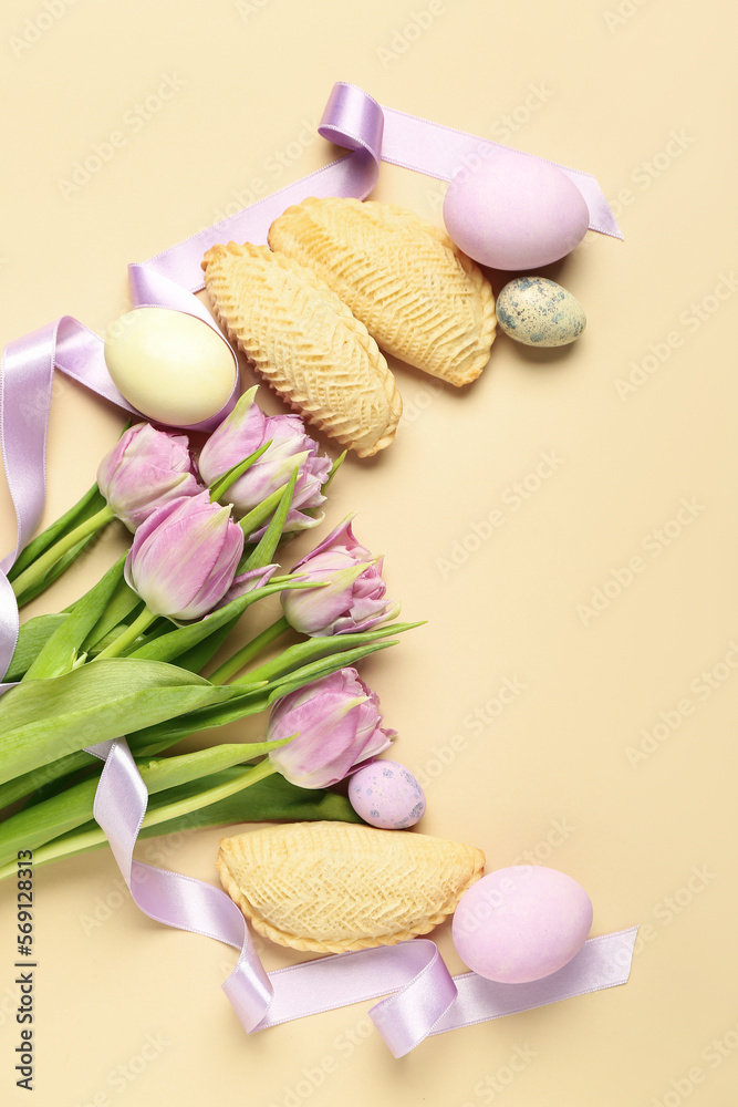 Tulips with eggs and shekarbura on beige background. Novruz Bayram celebration