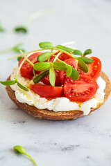 Canvas Print - Toast with cream cheese, cherry tomatoes and micro greens. Healthy breakfast concept.