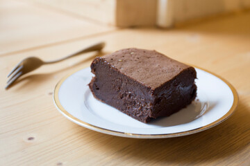 Wall Mural - A brownie is a small chocolate cake, typical of the gastronomy of the United States. It is named for its dark brown color, or brown in English.