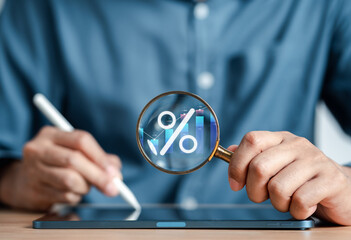 Aufkleber - Businessman accounting for increase financial chart and investment growth from dividend, Businessman holding magnifier with percentage icon. Finance and Money, Save money for prepare in the future.