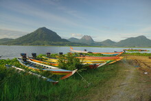 Fishing Boats Anchored At The Jatiluhur Reservoir. Beautiful View Of Jatiluhur Reservoir With Mountains In The Background.