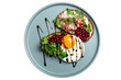 Sandwiches with jamon and fried egg on a plate decorated with herbs and sprinkled with pomegranate seeds on isolated png background top view
