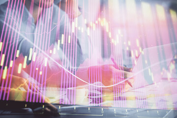 Poster - Double exposure of man and woman working together and financial graph hologram. Business concept. Computer background.