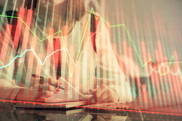 Poster - Double exposure of businesswoman hands typing on computer and financial graph hologram drawing. Stock market analysis concept.