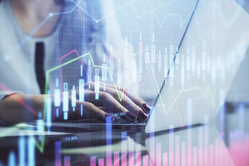 Poster - Double exposure of woman hands typing on computer and financial graph hologram drawing. Stock market analysis concept.