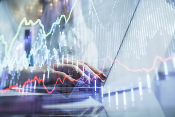 Poster - Double exposure of woman hands typing on computer and financial graph hologram drawing. Stock market analysis concept.