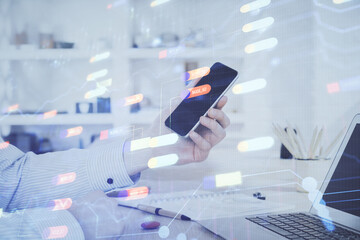 Poster - Double exposure of man's hand holding and using a digital device and data theme hologram drawing. Technology concept.