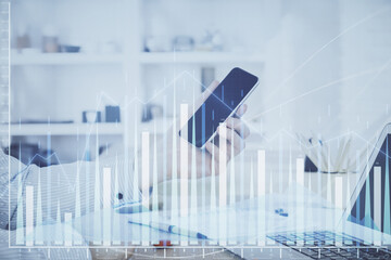 Poster - Double exposure of man's hands holding and using a digital device and forex graph drawing. Financial market concept.