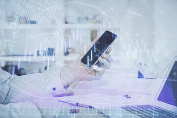 Poster - Double exposure of man's hands holding and using a digital device and forex graph drawing. Financial market concept.