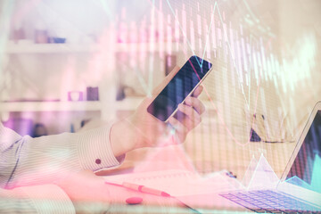 Aufkleber - Double exposure of man's hands holding and using a digital device and forex graph drawing. Financial market concept.