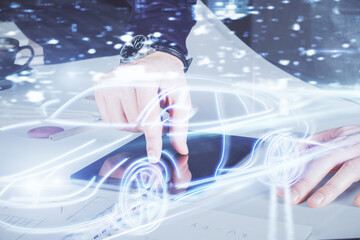 Poster - Double exposure of man's hands holding and using a digital device and automobile theme hologram drawing. Technology concept.