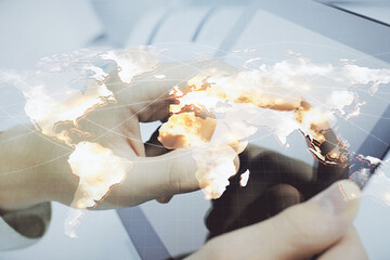 Fototapete - Double exposure of man's hands holding and using a phone and international business theme drawing.