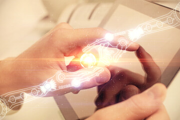 Poster - Multi exposure of man's hand holding and using a digital device and data theme drawing. Innovation concept.